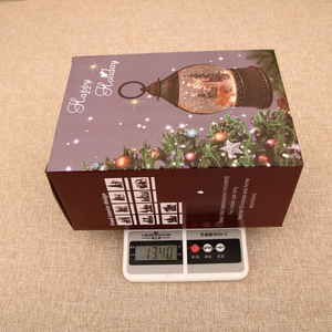 Detailed view of the Christmas water lantern gift box showing weight of 1340g