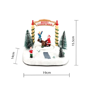 Detailed size view of glowing Christmas music box with snowy scene and merry christmas arch