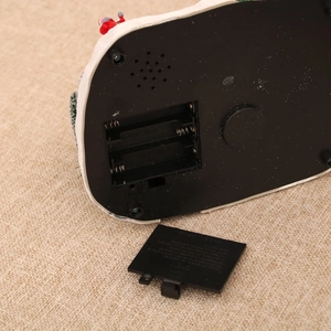 Detail view of the black plastic bottom base showing double AA battery compartment