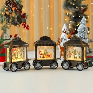 Vintage Christmas carriage music box with internal LED lights and swirling glitter snow effect