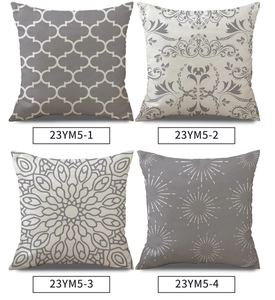 Detail view of four linen cushion covers with grey and beige ethnic geometric patterns