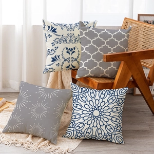 Set of four linen-textured pillowcases with navy and gray bohemian mandala patterns
