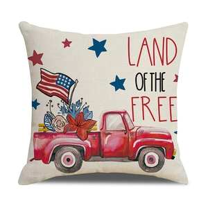 Detail of linen pillow cover featuring vintage red truck and Land of the Free text