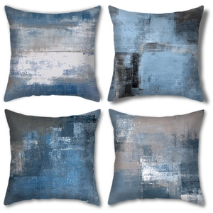 Detail of four abstract oil painting style cushion covers in blue and grey textures