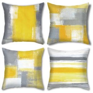 Set of four modern abstract oil painting style cushion covers in bright yellow and grey