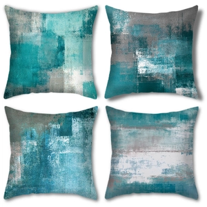 Macro detail of four square cushion covers with abstract teal oil painting patterns