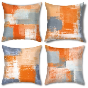 Detail of four square pillow covers featuring modern abstract geometric prints and textures