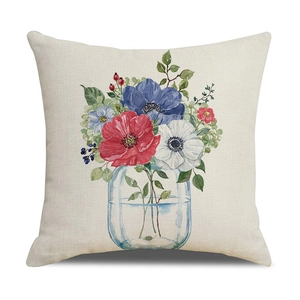 Detail of linen pillowcase featuring a watercolor floral bouquet in a blue glass vase
