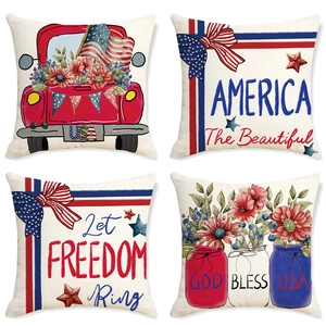 Detail of four patriotic American style linen pillow covers with stars and red trucks