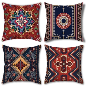Detail of four Bohemian Persian style pillow covers with intricate geometric floral patterns