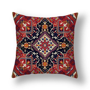 Detail of Persian style red cushion cover with intricate ethnic geometric print patterns