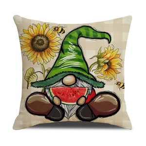 Detail of linen cushion cover featuring a cartoon summer gnome with watermelon and sunflowers