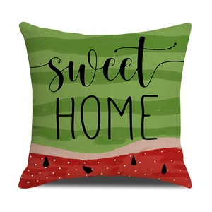 Close-up of linen pillowcase with sweet HOME text and summer watermelon print texture
