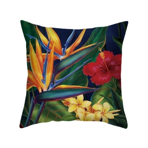 Tropical cushion cover with bird of paradise and hibiscus print on dark blue fabric