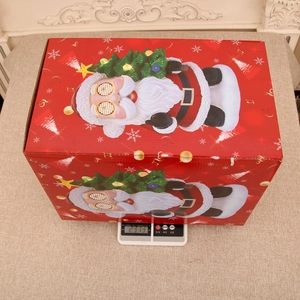 Macro shot showing the resin Santa music box packaging weighing 2313g on a scale