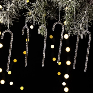 Set of 6 transparent acrylic candy cane ornaments hanging on a festive Christmas tree branch