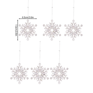 Detailed view of clear acrylic Christmas snowflake ornaments with size measurements