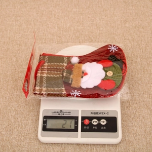 Close-up of Santa Claus themed Christmas stocking with plaid patterns and 21g weight display