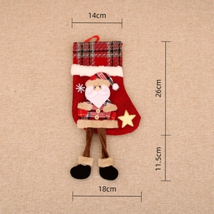 Detailed size specifications of a red plaid Christmas stocking with Santa Claus doll
