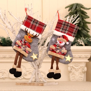Christmas stockings set with reindeer and snowman designs on a grey felt background