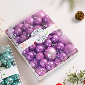 Detail of Christmas balls in various finishes with festive holiday packaging decor