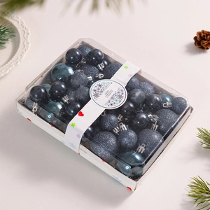 Detail of 42-piece navy blue Christmas ball set in festive box with snowflake sleeve
