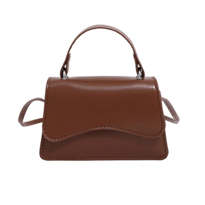Minimalist brown PU leather crossbody bag with wavy flap and silver metal hardware
