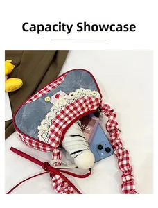 Detail view of denim patchwork handbag capacity showing phone, umbrella and makeup