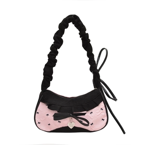 Pink embossed floral underarm bag with black lace trim and heart pendant