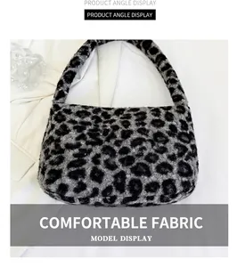 Detail shot of plush grey leopard print underarm bag with soft faux fur texture