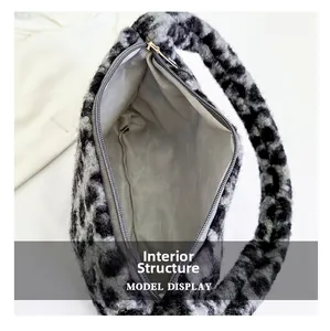 Detail view of leopard print shoulder bag interior with zipper closure and fabric lining