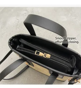 Detailed close-up of inner metal zipper and black lining of a chic bucket bag
