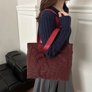 Fashionable dark burgundy leopard print tote bag with bright red nylon straps for women