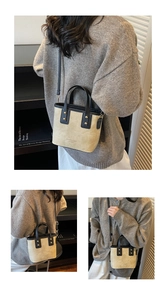 Three-way view of beige and black contrast square bag with gold rivet accents