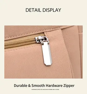 Detail of smooth silver metal zipper and twill fabric texture on large tote bag