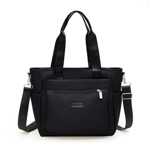 Black waterproof nylon tote bag with adjustable shoulder strap and large capacity