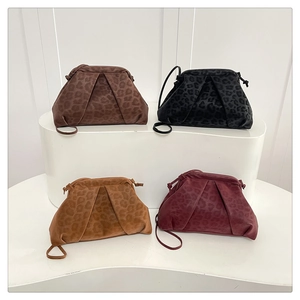 Gathering of leopard print pleated crossbody cloud bags in four classic autumn colors