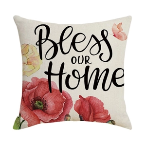 Linen decorative pillow cover with Bless OUR Home text and red poppy floral patterns