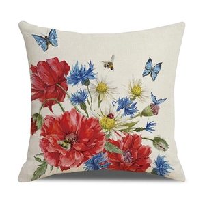 Detailed macro view of linen pillowcase with red poppies and blue cornflower print
