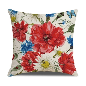Detailed view of linen pillowcase with retro hand-painted poppy and daisy patterns