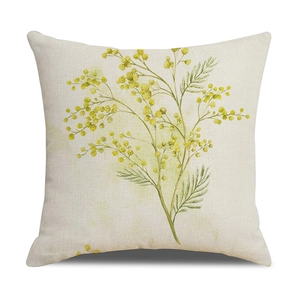 Detailed texture of beige linen cushion cover featuring yellow mimosa floral print