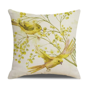 Close-up of cotton linen pillow cover with yellow bird and mimosa floral watercolor print