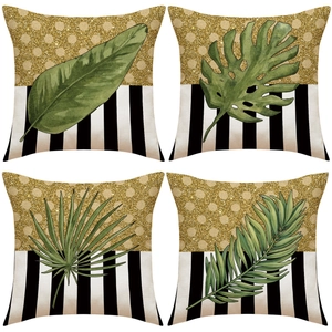 Juego de cuatro fundas de cojín con hojas tropicales y diseño de lentejuelas doradas
