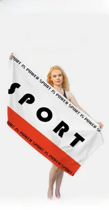 Detail of large quick-dry microfiber beach towel with red sport stripes and soft texture
