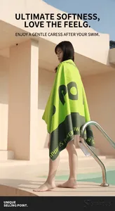 Detail of neon green and grey hooded microfiber sport towel with Sport Is Power text