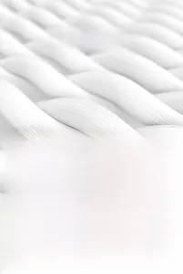 Macro shot of high-density microfiber sand-free beach towel showing quick-dry texture