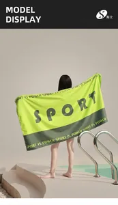 Detail of oversized microfiber beach towel showing high-absorbent sand-free fabric texture
