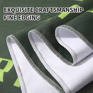 Large green microfiber beach towel with reinforced overlocking edge and sand-free texture