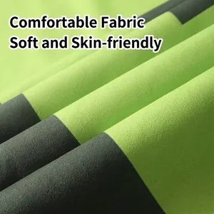 Oversized quick-dry beach towel featuring lime green and dark grey stripes in soft microfiber