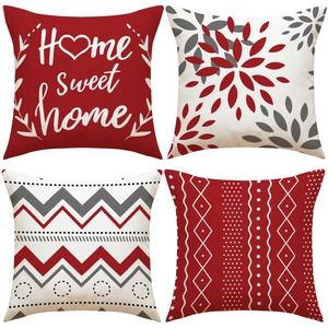 Detail of 4-pack linen pillow covers featuring red geometric patterns and Home Sweet Home text